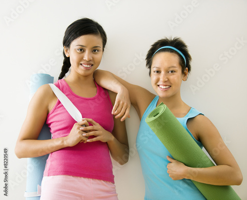 Women with yoga mats