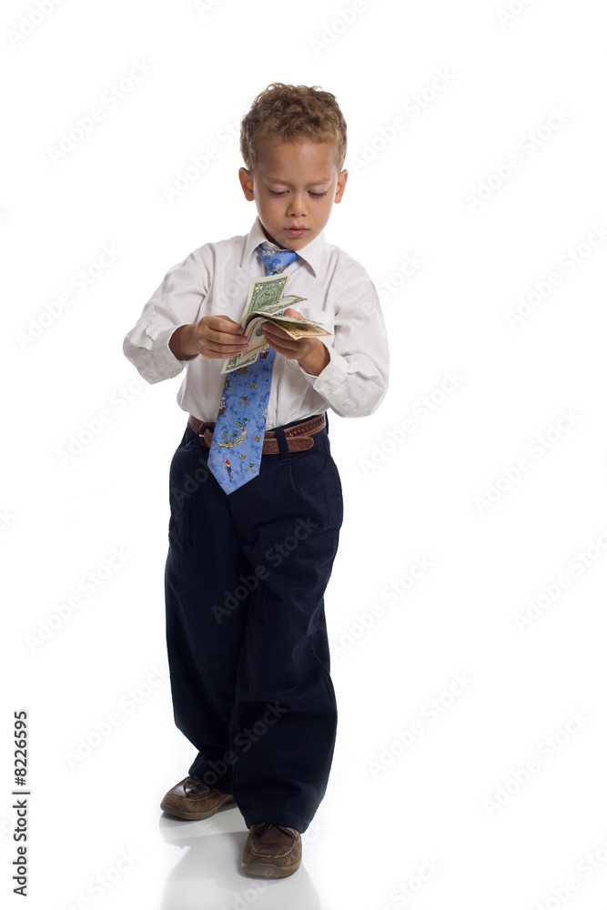 Young boy dressed as businessman holds money - isolated on white Young boy dressed as businessman holds money - isolated on white