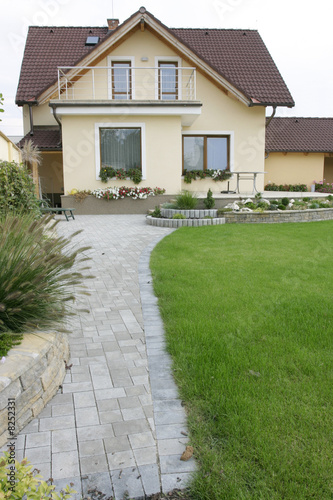 Yellow hous and summer garden.