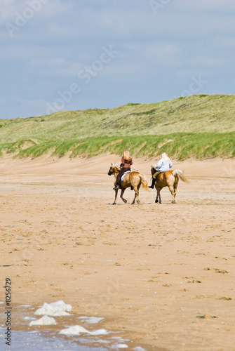 Horse riders on beach