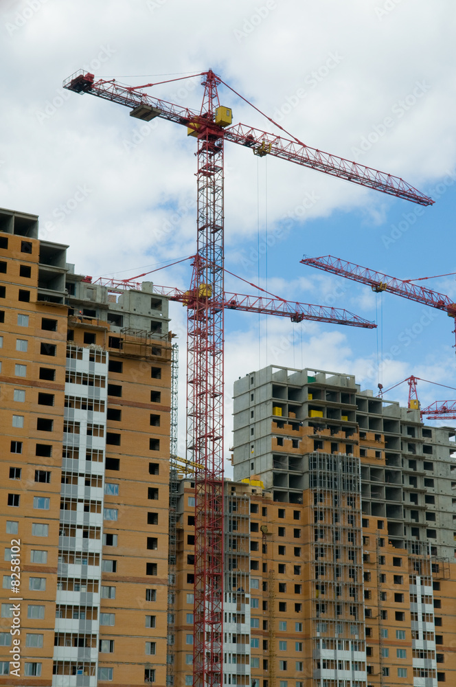 Construction of skyscrapers on a background of the dark blue sky Construction of skyscrapers on a background of the dark blue sky
