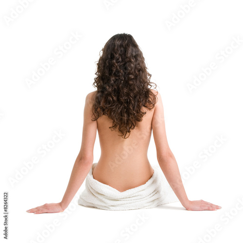Girl with towel sitting on the floor