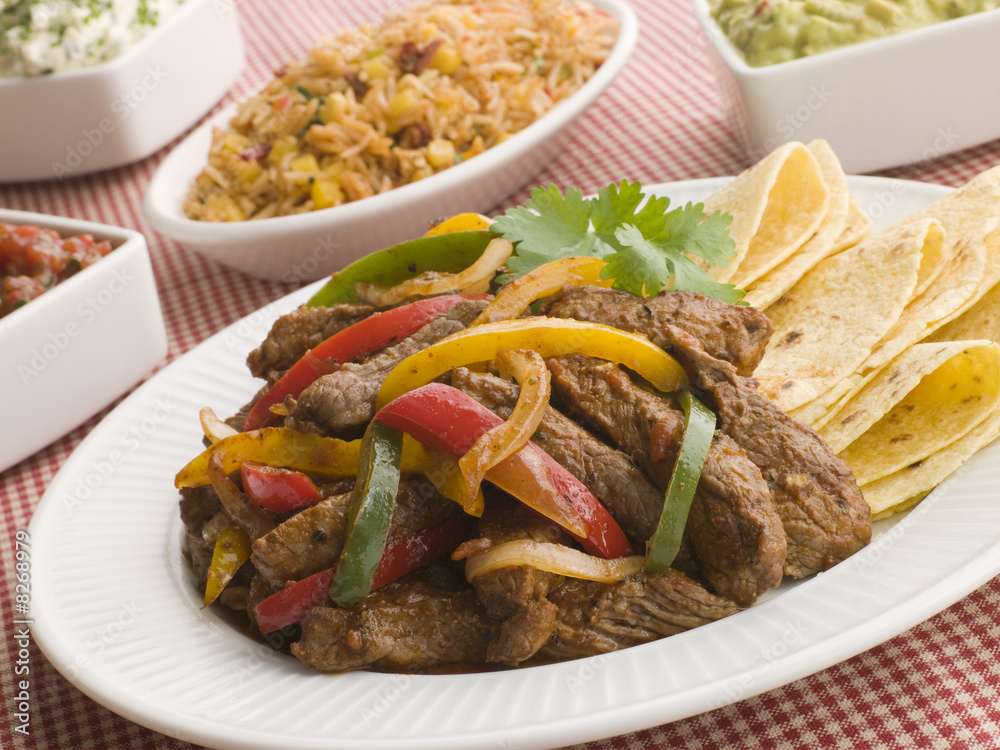 Steak Fajitas with Jambalaya, Guacamole, Salsa and Sour Cream Stock 写真