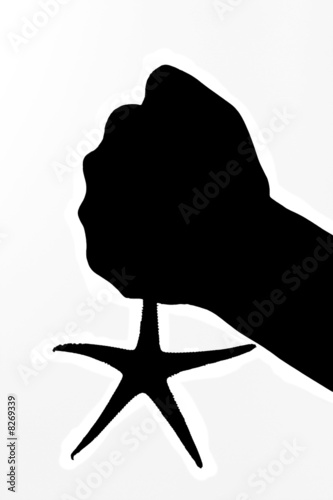 hand holing sea star