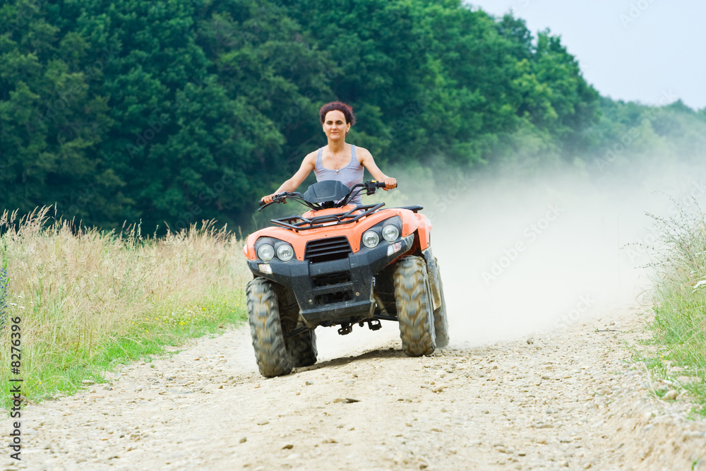 Fototapeta premium Woman riding ATV