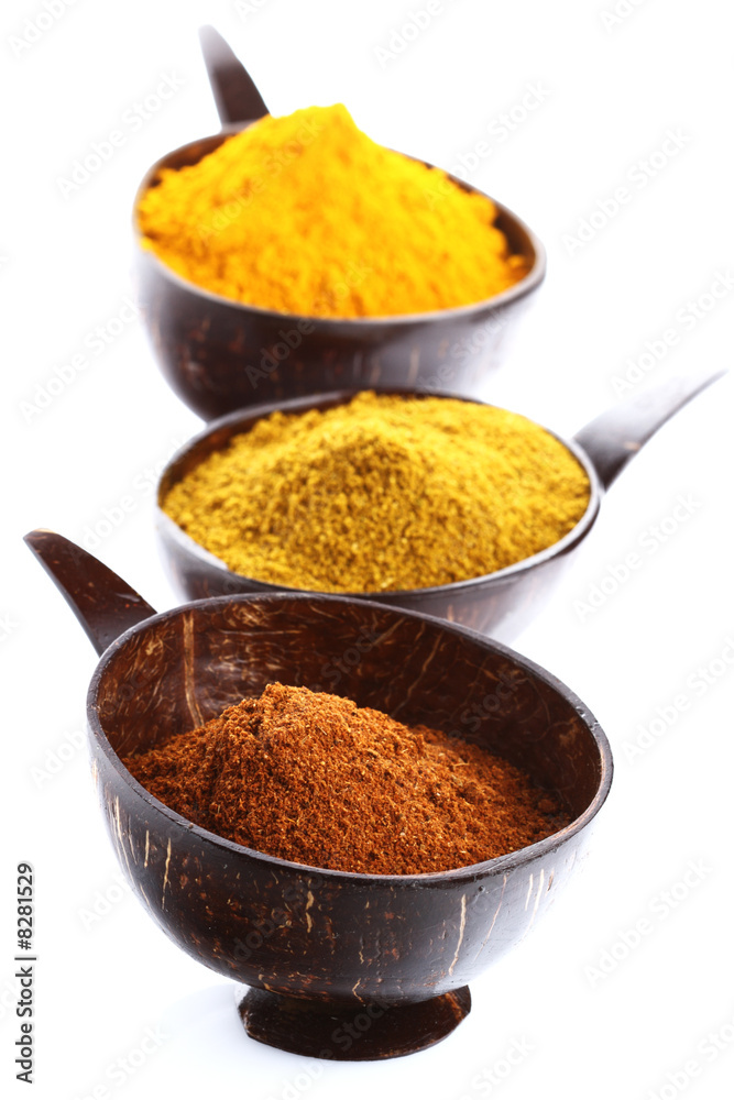 spices - pile of bright Madras Curry Powder and 2 bowls behind
