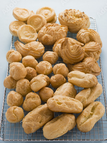 Selection of Choux Pastry Buns on a Cooling Rack