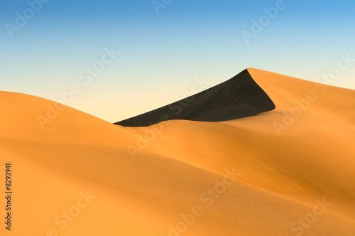 sand dunes over blue sky © javarman