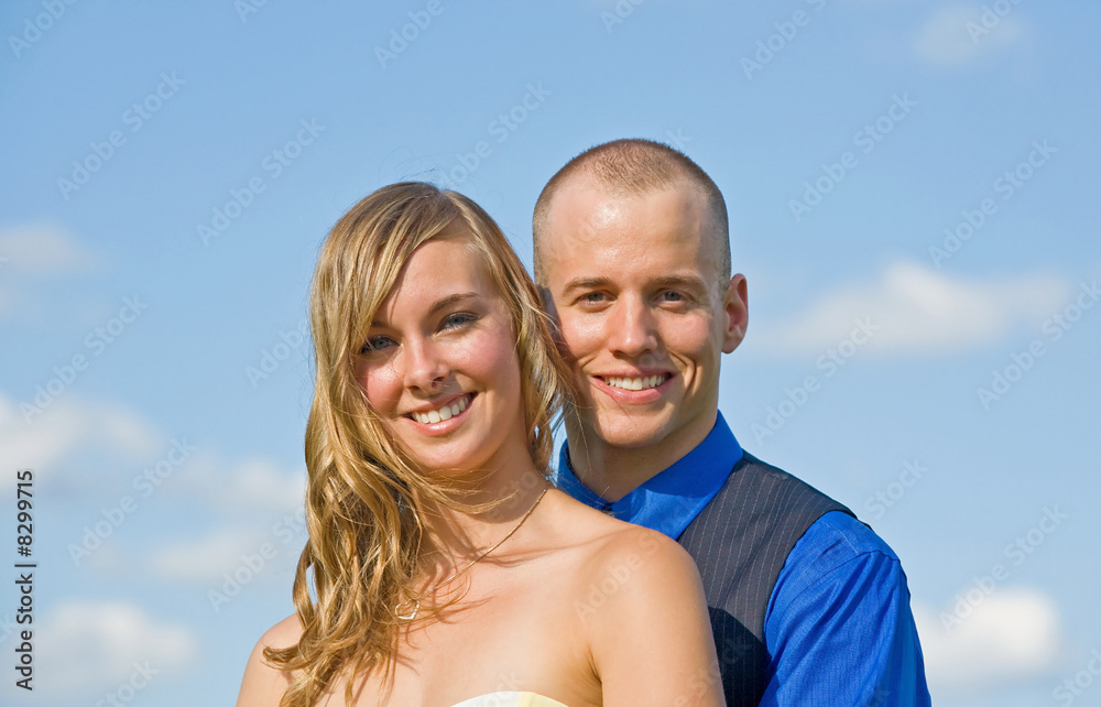 Couple Against a Cloudy Blue Sky Couple Against a Cloudy Blue Sky