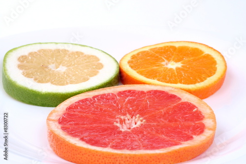 Three slice fresh citrus isolated on white