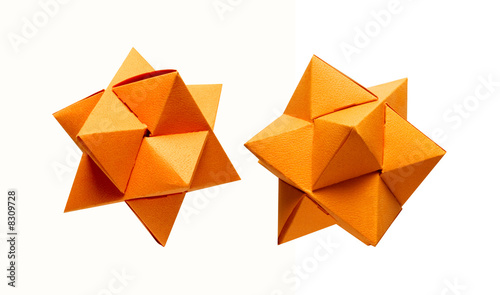 Two orange paper geometrical isolated stars