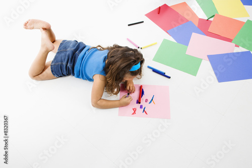 Hispanic girl coloring.