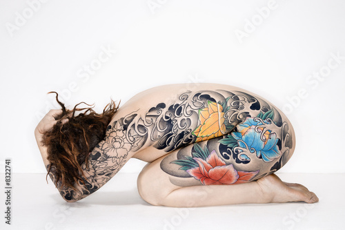 Nude tattooed woman