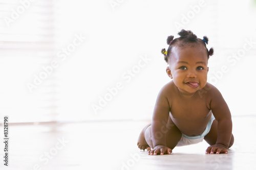 Baby crawling indoors