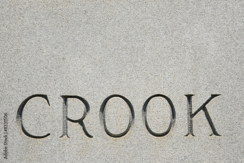 Word "crook" on gravestone.