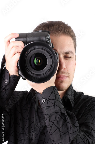 Portrait of young photographer(isolated on white)