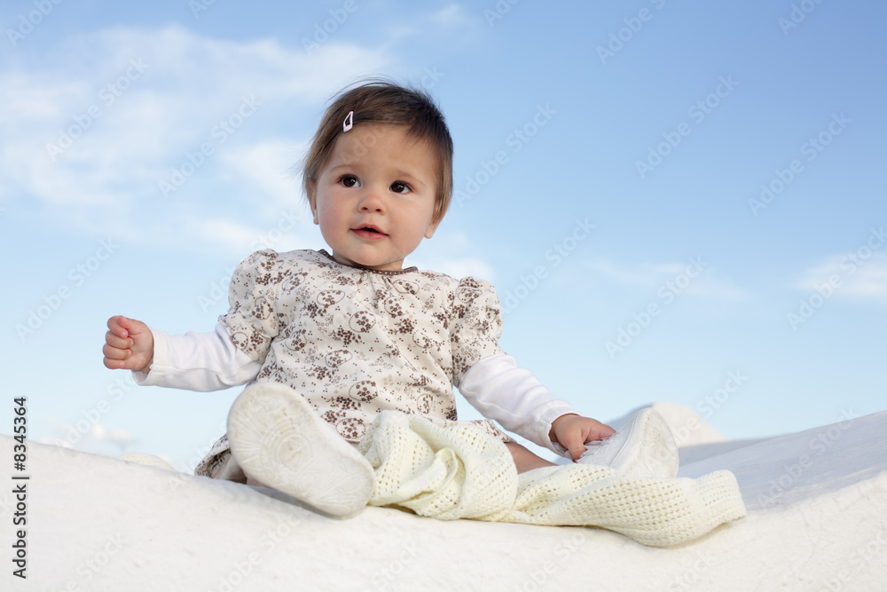 cute baby girl over sky background cute baby girl over sky background