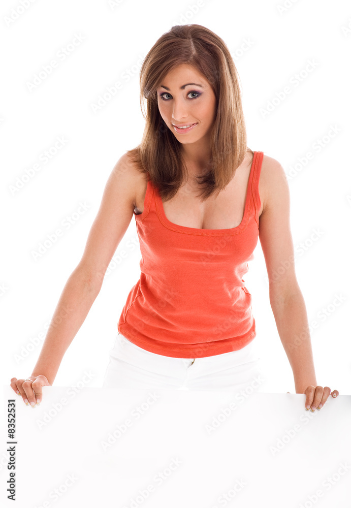 Beautiful young woman holding empty white billboard Beautiful young woman holding empty white billboard