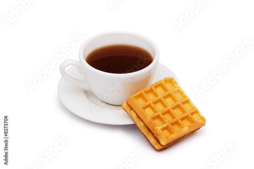Tea and belgian waffles isolated on the white