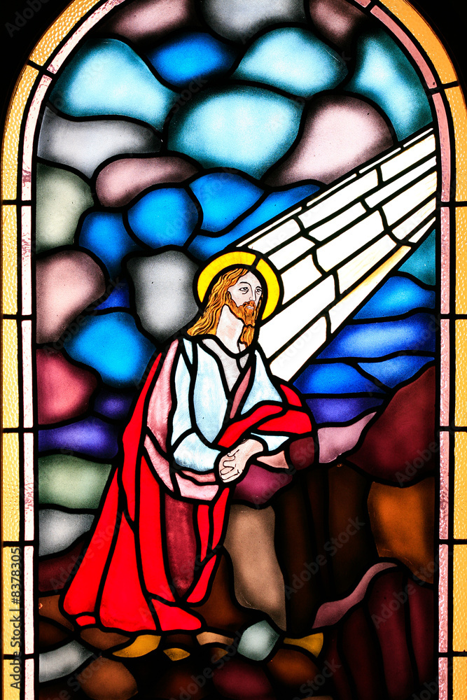 Religious stained glass window in a church.
