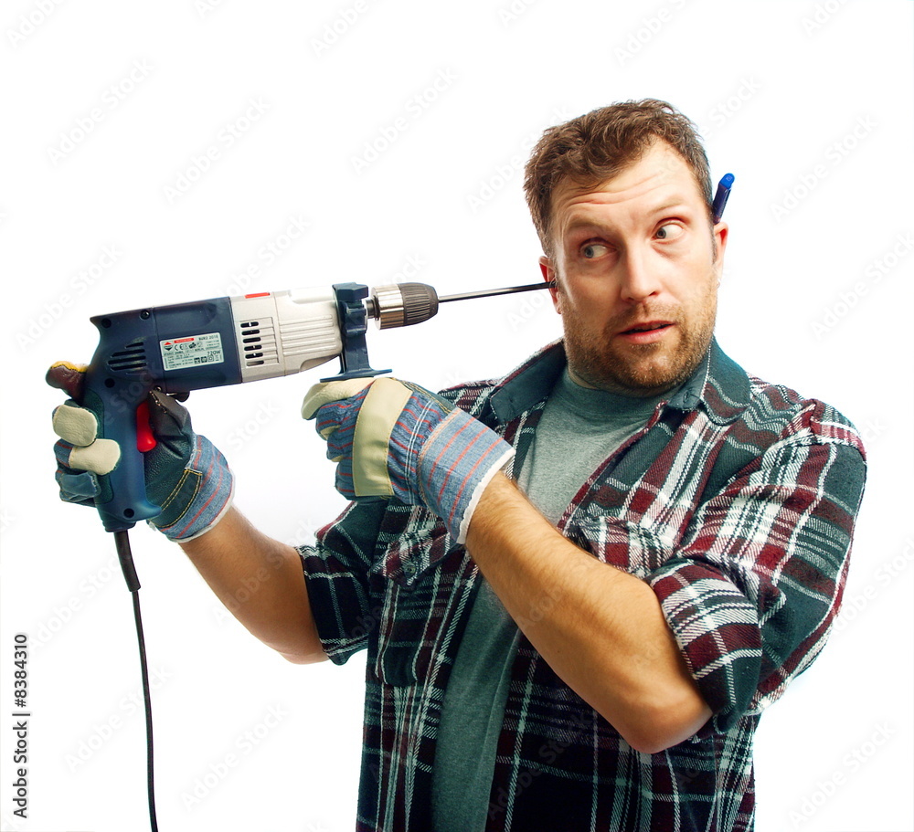 Funny workman with drill boring his ear on white background Funny workman with drill boring his ear on white background