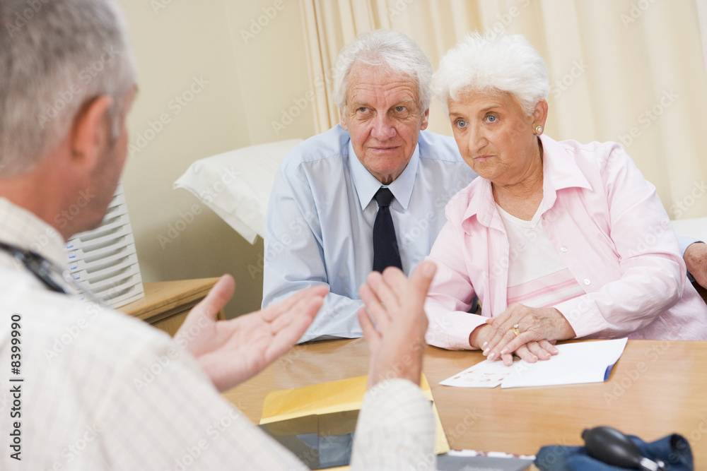 Couple in doctor's office frowning