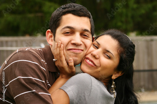 Happy hispanic couple hugging © Monart Design