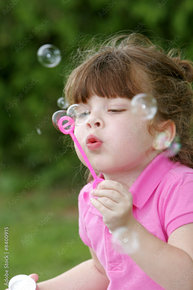 girl blowing bubbles girl blowing bubbles