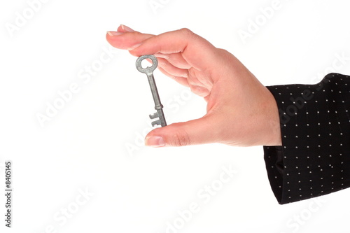 Woman s hand holding a key