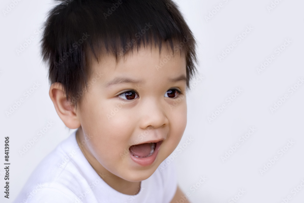 Little boy, surprised, looking away from camera Little boy, surprised, looking away from camera