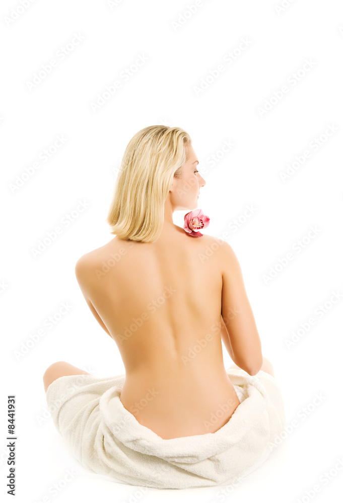 Obraz premium Beautiful young woman with orchid flower