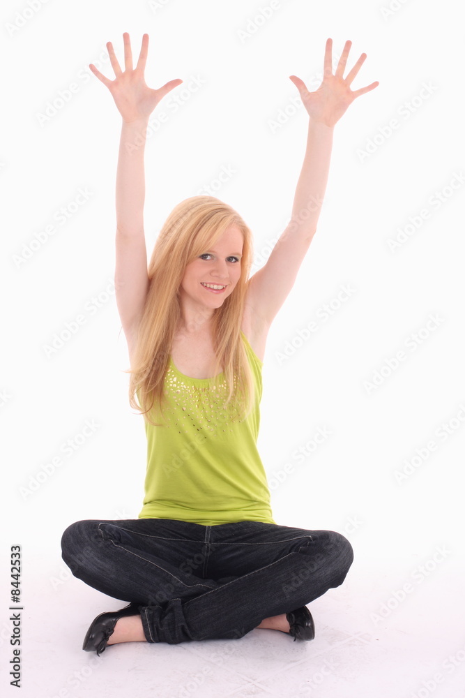 Teenager sitting on floor