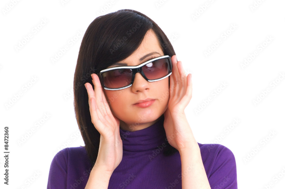 Young girl in sunglasses isolated on the white Young girl in sunglasses isolated on the white