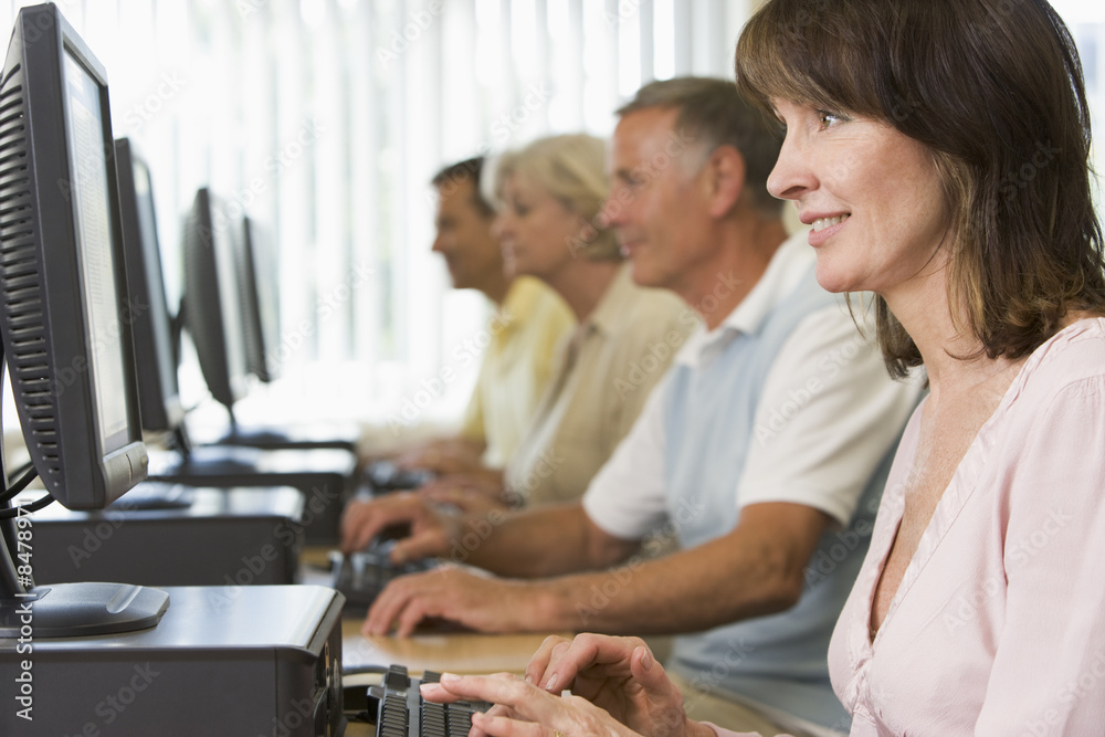 Adult students in a computer lab Adult students in a computer lab