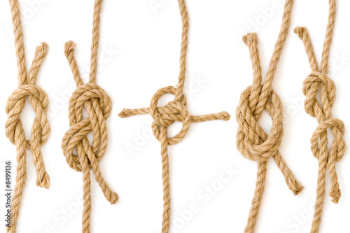 Four pieces of rope fastened in four different knots photo