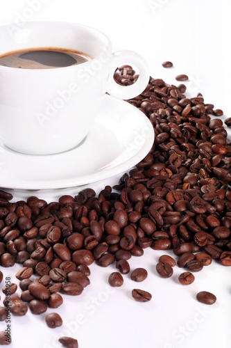 Coffee and coffee beans in white cup isolated