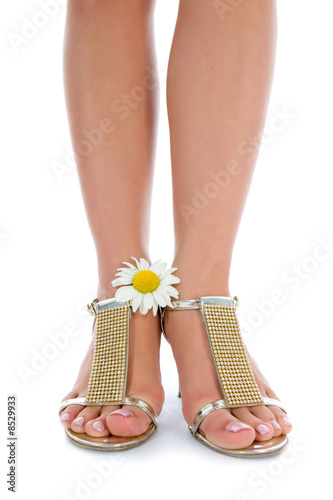 long legs on high heels with flowers photo