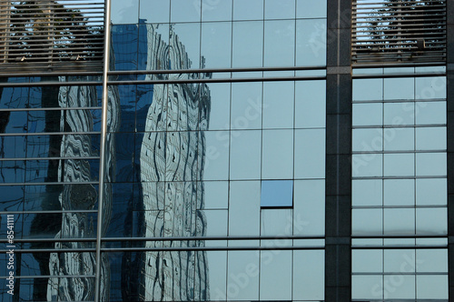 Chinese skyscraper in reflection
