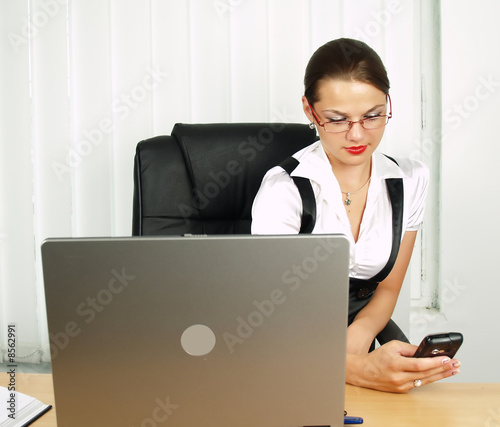 attractive business woman setting the mobile photo