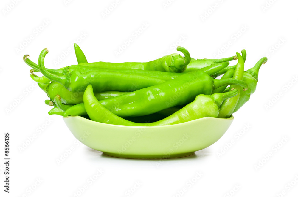 Green peppers in the plate isolated on white Green peppers in the plate isolated on white