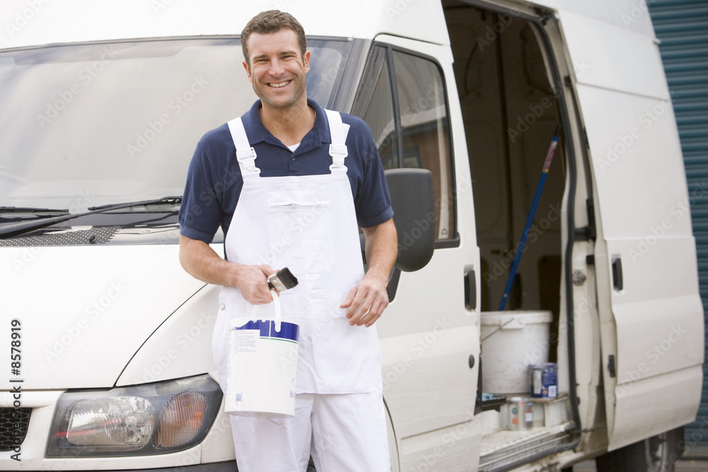 Painter standing with van smiling Painter standing with van smiling