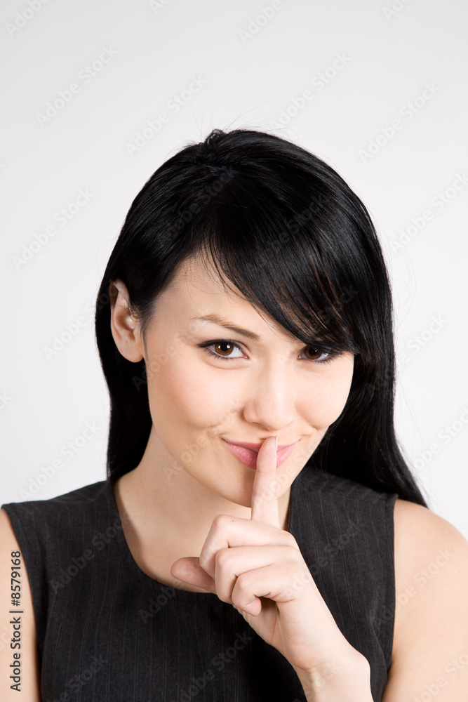 Businesswoman shushing