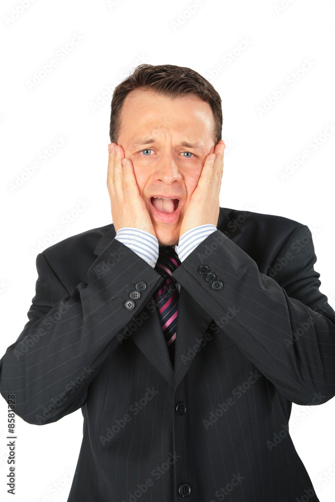 Strongly afflicted businessman keeps hands for head