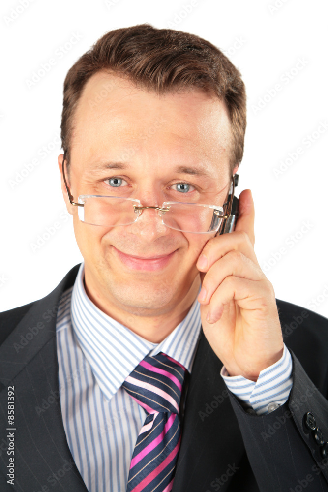 businessman in glasses speaks on cell phone businessman in glasses speaks on cell phone