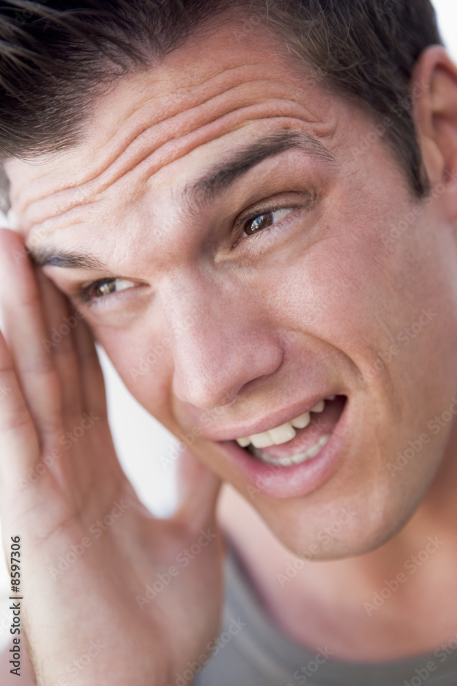 Obraz premium Head shot of man scowling