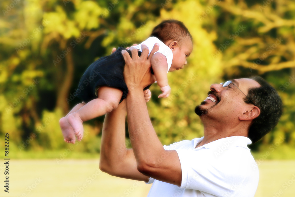 Grandfather Holding Grandson in the Air Outdoors Grandfather Holding Grandson in the Air Outdoors