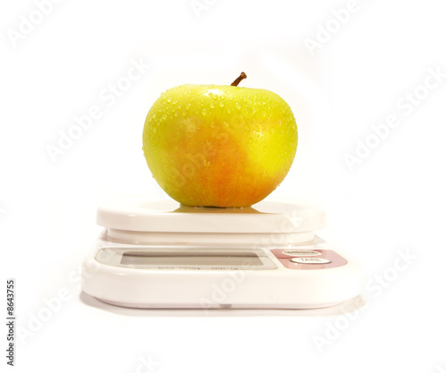 Yellow apple and scale isolared