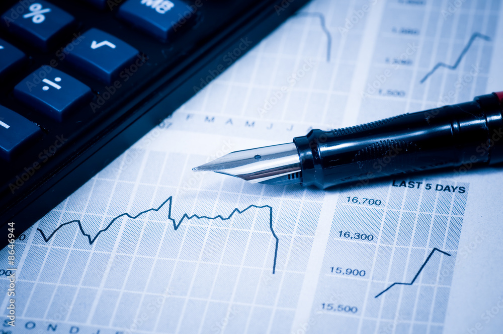 Business concept: The calculator, pen and diagram Business concept: The calculator, pen and diagram