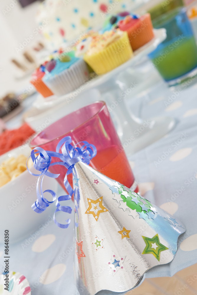 Birthday party table setting with food Birthday party table setting with food