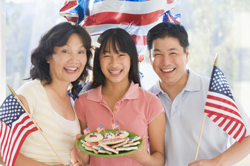 Family on fourth of July with flags